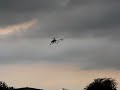 Honeybee king 2 RC Helicopter hovering and flying in park Honeybee king 2 RC Helicopter hovering and flying in park