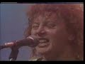dd smash was dave dobbyn's band after th' dudes.

in mid-1981, dobbyn forged his coup de grace - dave dobbyn's divers. thankfully a name change eventuated to dd smash. a guitar-driven four piece, the band settled straight into live work. auckland venues were at their height and work was plentiful. the fan base fattened by the week.

by late '81, dd smash signed a recording deal and immediately set about recording their debut album, with ian morris in the producer's chair. 

dd smash released their debut album in 1982. titled 'cool bananas' it debuted in the national chart at #1, an historic first. it remained in the chart for 24 weeks and became triple gold. the album's biggest hit was the fantastic 'devil you know'. in '82 the 'top male vocalist' award was won by dobbyn, 'top group' went to dd smash, 'cool bananas' won 'album of the year', ian morris got 'producer of the year' for it, and the album even won 'engineer of the year' and 'best sleeve design'.

the band toured relentlessly to a strong response and in mid-82 journeyed to australia for an investigative trip. they worked regularly and dobbyn continued to write. they returned to nz in october and dobbyn quickly recruited a brass section. a new sound fell into place.

a new single was recorded in auckland in 1983 and released shortly after. 'outlook for thursday' crashed into the national chart and peaked at #3, spending 23 weeks in the chart. the nation was enthralled with the new brassy dd smash, and the quirky video which played week after week on ready to roll. the single achieved gold status. 

radio with pictures devoted a live tv special to dd smash, which was subsequently released as the album 'live: deep in the heart of taxes'. the band monopolised the annual record awards for the second year in a row. the 'top male vocalist' award was again won by dobbyn, 'top group' went to dd smash for the second year running. 'outlook for thursday' was 'single of the year', and 'live: deep in the heart of taxes' was voted 'album of the year'. dd smash was 'most popular band', and 'video of the year' went to... 'outlook for thursday'.

dobbyn and his band moved to sydney to record their second studio album, and world domination seemed imminent. he finished 1983 by getting married. 

this time the producer was charles fisher. released in 1984, 'the optimist' was an unqualified success spawning two hit singles 'whaling'. and 'magic (what she do)'. it eventually outsold its predecessor. the album's sophisticated production and eclectic repertoire were a marked contrast to the twin-guitar elementary tenor of 'cool bananas'. touring continued with dobbyn's by-now line-up of principally australian musicians.

the quirky, infectious pop songs seemed to come naturally ('outlook for thursday', 'magic (what she do)'). but the purity of a classic songwriter was always there. on stage with dd smash, he would take time out for 'guilty', his torch song debut. 'whaling' is a timeless sea-shanty, written on a beer mat one lonely night and now an unofficial national anthem.

a celebration of the beginning of the 1984 summer turned into mayhem - thanks to the combination of the crowd drinking all afternoon in the hot sun, and over-enthusiastic riot police. dobbyn tried to calm things down from the stage, but the words he used were badly chosen. dobbyn subsequently found himself charged with inciting the riot.

there was no point touring to support an album called 'the optimist'. dobbyn laughs now, but then, after two years as the most popular musician in the country, there was a sense of betrayal.

band members:
peter 'rooda' warren (drums, vocals, percussion)
rob 'revox' guy (guitar)
lisle kinney (bass)
dave dobbyn (guitar, vocals, keyboards)

http://www.muzic.net.nz/artists/224.html
http://en.wikipedia.org/wiki/dd_smash
http://www.nzmusic.com/taxonomy/term/436