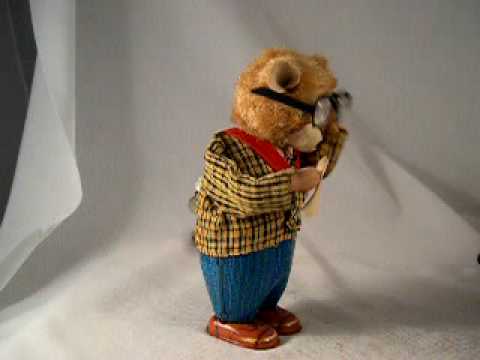 antique Toys 1950's - What a terrific old wind-up toy! The bear is made of tin, and when wound up he takes off his big spectacle glasses and wipes them clean with a cloth! Then he...