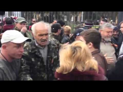 Pro-Russian group of men tear apart signs of peaceful women's group