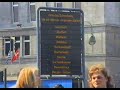 some primarily u-bahn (underground railway / subway) related views filmed in berlin in april 1990, which was after the wall had been opened but when the city was still divided. 

1) alexanderplatz was the focal point for the eastern part of berlin, and here we see some large & small profile u-bahn trains (note the 'door closing' lights and bells) plus the main centrum department store and a shop selling 'western' products for people with 'hard' currency (ie: �, $, dm, etc). 

not filmed (to avoid possible arrest) were signs inside centrum in german, french, english and russian saying that many of the goods on display could only be sold to people with berlin residency cards (ie: people from the part of berlin in the former ddr / gdr).

there is also a ride inside a small profile u-bahn train.

2) wittenbergplatz was part of the focal point for the western part of berlin, and here we see a gift from london transport, some small profile u-bahn trains (note the lack of any type of 'door closing' alarms) plus some internal & external views of the restored station booking hall and the  nearby large kadewe department store.

3) a ride through some closed stations inside a large profile u-bahn train on line u8.

after the building of the wall in 1961 the u8 only carried west berliners, linking suburbs to the north and the south of the city via alexanderplatz but with the stations in the eastern controlled part of berlin being sealed so that no-one could enter / leave them and armed guards on the station platforms to kill anyone who tried to board a passing train.

at the time of filming one station (rosenthaler platz) had already been reopened, but the other 5 (on u8) remained closed, with the platforms dimly lit, and trains travelling through without stopping.

4) a photograph taken in december 1989 of a typical u-bahn station in east berlin which because the trains which served it ran through to west berlin was closed.