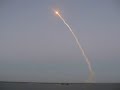 Some footage from the Discovery STS-119 shuttle launch, as viewed from Titusville, FL.. The first few seconds almost looks like an atomic bomb.. Later on, the top part of the smoke plume catches the sun, which is below the horizon in the west (behind me), but at enough of an angle to hit the plume in the sky and create some pink and red colors on the smoke.