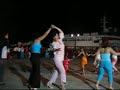 2005 on the island of alonissos in the northern aegean. the local band sometimes plays slightly out of tune but it only adds to the atmosphere. 

the names of people dancing are:
-
-
-
alekos borat zazopoulos  giannis fyssas  nana mouskouri  
alkinoos ioannidis  giannis karmas  natasa zenetzi  
alkistis protopsalti  giannis mpanios  natassa theodoridou  
anestis mantas  giannis parios  nicos portokaloglou  
angela demitriou  giannis savidakis  nikolas asimos  
angeliki eliadi  giorgos zervakis  nikos iakovidis  
anna vissi  hi 5  nikos karvelas  
antique  haris & panos katsimihas  nikos xylouris  
antonis livieratos  haris alexiou  notis sfakianakis  
antonis remos  jason thanos  paparizou elena  
antonis vardis  kaiti garbi  pashalidis miltos  
apostolos nikolaidis  kaiti livanou  pavlos sidiropoulos  
arvanitaki eleftheria  kalliopi vetta  peggy zina  
athena haikali  katsoulis vangelis  peny xenaki  
bigalis kostas  kostas makedonas  petros imvrios  
christos dantis  labis livieratos  pix-lax  
christos kiriazis  lefteris pantazis  ploutarhos giannis  
demis roussos  mando  sakis rouvas  
despina vandi  manolis famellos  stelios kazantzidis  
dimitra galani  manos hatzidakis  stella georgiadou  
dimitris panagopoulos  marcos  triantafillos  
dionisis shinas  margarita zorbala  vasilis karas  
dytikes synoikies  maria farantouri  vasilis papakonstantinou  
elena paparizou  maria louiza vassilopoulou  vicky leandros  
eleni peta  maria polykandrioti  victoria chalkiti  
eleni tsaligopoulou  maria stavropoulos  xristina delli  
evridiki  melina kana  yanni  
elli kokkinou mariada petridi yiannis fyssas 
fatme - portokaloglou  melina tanagri  yannis k. ioannou 
george alkaios  michalis hadjigiannis  yiannis karmas 
george dalaras  michalis rakintzis  yiannis kotsiras  
george mazonakis  mitropanos dimitris  yiannis mpanios 
 george scordilis    yiannis parios 
 giorgos tsalikis   yiannis savidakis

athens skopelos skiathos volos thessaloniki crete rhodos kos corfu levkas kithera peloponessos santorini lesbos