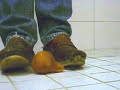Clogs crushing a pear Clogs crushing a pear
