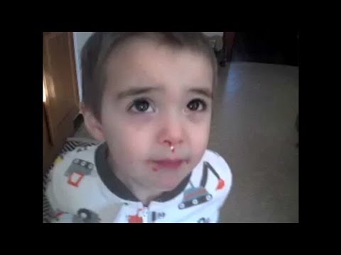faced - A young boy denies to his mother that he ate the sprinkles, but his red face says otherwise.