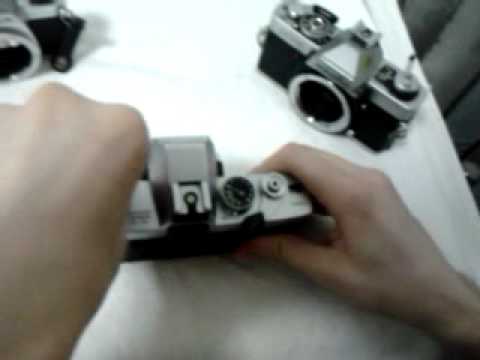 how to open a minolta xg 1 camera