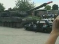 Tank crushes car