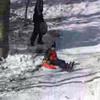 Luke sledding at the Land