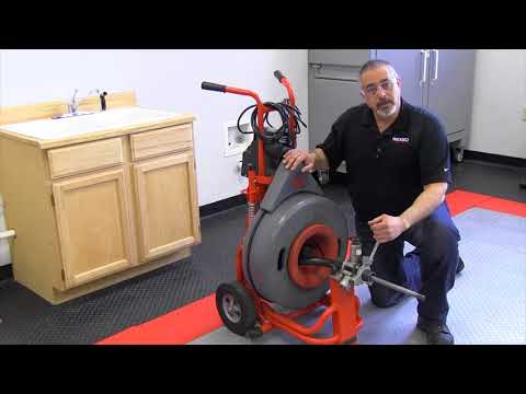 How to adjust the power feed on the RIDGID K7500 drum machine