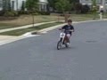 longboarding (kid goes into trash can)