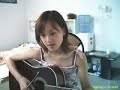 A girl is singing a sog bt guita