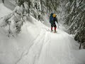 heavy pack and long ski out causes crash on steep switchback.