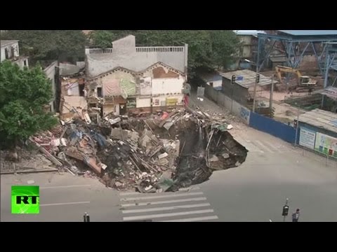 Sinkholes China on Dramatic Video  Giant Sinkhole Swallows Two Buildings In China