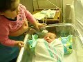 Hala checking out her baby brother