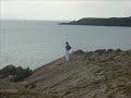 Derek Plays You Raise Me Up on Harmonica with Barry Island in Background