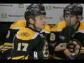 Milan Lucic hits Mike Van Ryn through the Glass
