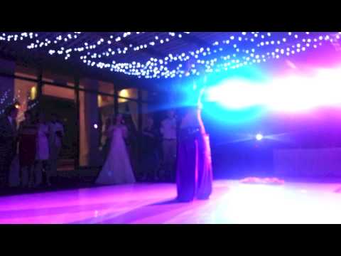 Lara belly dances at a wedding in Mexico