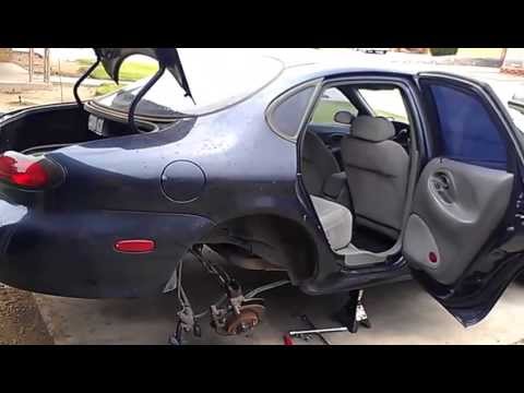 How to: Ford Taurus Rear Strut Install and Removal (Bent Strut)