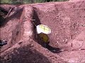 Embankment for rock fall protection with geogrid in HDPE