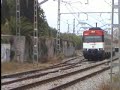 Trains pass at Calella/Cruzamento a Calella.
