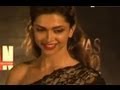 Deepika Padukone escorts Nargis Fakhri at an event