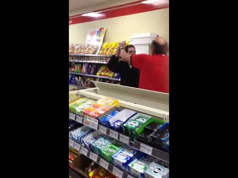 IN - Wasted girl freaking out at store clerks + Store clerk hitting her man in the head with a baton = Chaos in 7-11.