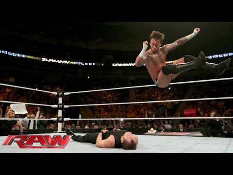 RAW - CM Punk and Dean Ambrose face off in the ring while the members of The Shield watch from ringside.