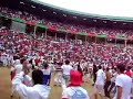Bull running around catching people - Pamplona S. Fermin Arena Run Bulls Encierro 2008 Ricardo Gomez