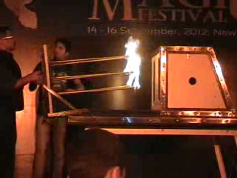 firespikes - Fire spikes go through girl in box. Magic performance by Magician Sumit Kharbanda in Delhi Magic Festival 2012. Every year Magic Festival is organised in Delhi.