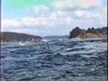 Sailboat struggling against fast current in Deception Pass