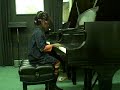 Sophie Ming is playing at her piano recital at the Stienway