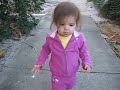 Lilli copies mommy by walking backward