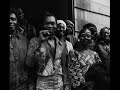 fela anikulapo kuti (born olufela olusegun oludotun ransome-kuti, october 15, 1938 - august 2, 1997), or simply fela, was a nigerian multi-instrumentalist musician and composer, pioneer of afrobeat music, human rights activist, and political maverick.

fela was born in abeokuta, ogun state, nigeria to a middle-class family. his mother, funmilayo ransome-kuti, was a feminist active in the anti-colonial movement and his father, reverend israel oludotun ransome-kuti, a protestant minister and school principal, was the first president of the nigerian union of teachers. his brothers, dr. beko ransome-kuti and olikoye ransome-kuti, were both well known in nigeria.

fela was sent to london in 1958 to study medicine but decided to study music instead at the trinity college of music. while there, he formed the band koola lobitos, playing a style of music that he would later call afrobeat. the style was a fusion of american jazz and funk with west african highlife. in 1961, fela married his first wife, remilekun (remi) taylor, with whom he would have three children (femi, yeni and sola). in 1963, fela moved back to nigeria, re-formed koola lobitos and trained as a radio producer for the nigerian broadcasting corporation. in 1969, fela took the band to the united states. while there, fela discovered the black power movement through sandra smith(now isidore) -- a partisan of the black panther party--which would heavily influence his music and political views and renamed the band 