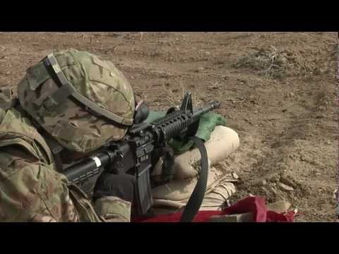 m4 - An NCO and his soldier at a range at a remote outpost in Afghanistan. Shots include close-ups of rounds discharging, rounds leaving the weapon, and the NCO g...