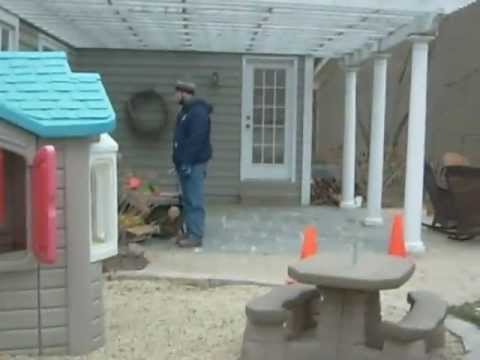 Naperville - This single mom with a chronically ill child is forced to watch helplessly as UPA installers hop her locked fence. An armed police escort accompanies the ins...