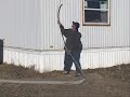 Blowing Insulation Into the Sidewall of a Mobile Home