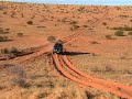 SIMPSON DESERT; RIG ROAD, SAND DUNES & THE LONE GUM TREE. SIMPSON DESERT; RIG ROAD, SAND DUNES & THE LONE GUM TREE.