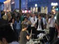 a boy playing drums in Karl johan in Oslo (Norway)