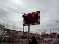 Train passing level crossing on Bollo Lane near Acton Town