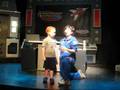 Orion on stage volunteering at a show, Astronaut HOF