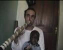 i'm playing my ugandan didjeridoo with bakhita in oluko village, arua district - north west of uganda