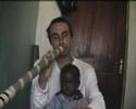 i'm playing my ugandan didjeridoo with bakhita in oluko village, arua district - north west of uganda