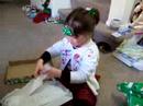 Kathleen opening Christmas presents at Rob & Amy\
