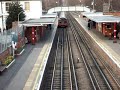 Central line train leaving Theydon Bois tube station