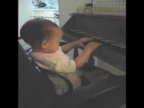 Baby playing spinet