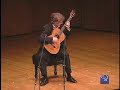 eliot fisk performing sevilla, by isaac alb�niz, at the new york guitar festival's third biennial guitar marathon at the 92nd street y's kaufman auditorium.
