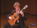 eliot fisk performing sevilla, by isaac alb�niz, at the new york guitar festival's third biennial guitar marathon at the 92nd street y's kaufman auditorium.