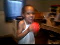 Little girl dunks thru her legs