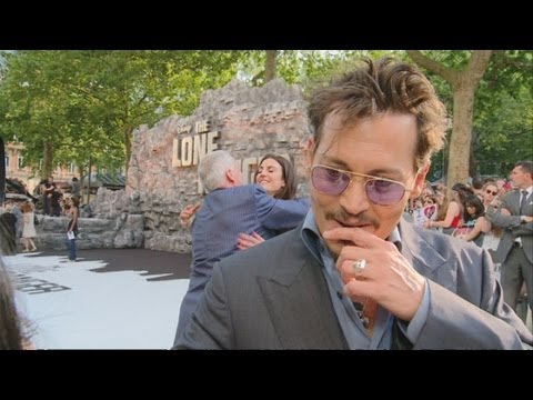 THE LONE RANGER: Johnny Depp wows fans on the red carpet in London