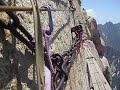 The HuaShan Plank Trail. Is it really the most dangerous trail on our dirt ball planet? There was only one way to find out and that was to go there myself instead of relying on Internet rumors. This might have been one of the more dangerous hikes in the world before the safety lines just above the chains and the required harness was added. Perhaps you have received an email showing pictures with what is billed as an insanely dangerous plank walk. There was one section where if the wood could talk, it would be crying out for a preemptive replacement but keeping the old planks intact after a few seasons of sun, snow and rain does give this place a heightened since of danger. HuaShan scenic area is a 2 hour bus ride from Xian. There is a train line that I believe stops at a nearby town within a few miles of HuaShan. I arrived in Xian after a 17 hour train ride from Shanghai. I did notice that work is being done on a ultra high speed line from Shanghai up to Xian which will cut the travel time to 5 hours. As for this hike being billed on the Internet as the 
